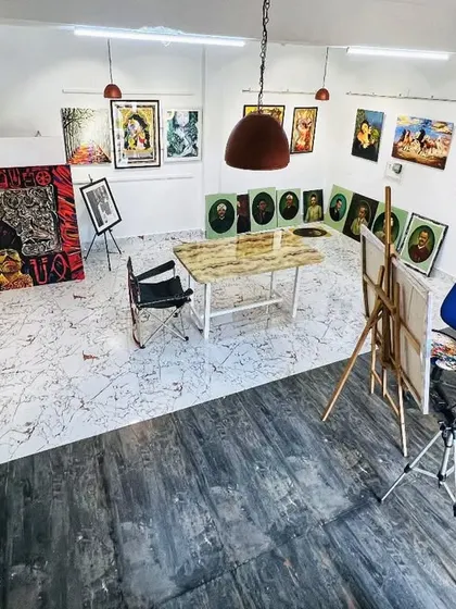 An overhead view of my studio, showing the layout of my workspace and the various paintings on display.