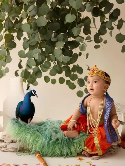 A divine portrait of a baby dressed as little Krishna. We respectfully create setups for cultural and festive themes that are important to your family.