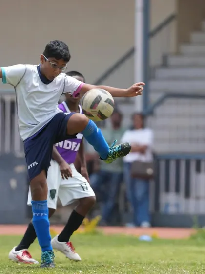 A player shows excellent ball control with his thigh during a competitive friendly match.