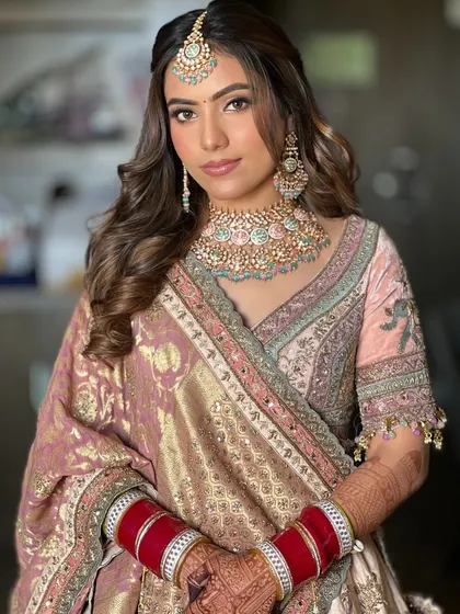 A classic half-up style with soft, flowing waves is one of my most requested looks. It’s timeless, romantic, and perfect for any wedding event, from the engagement to the reception.