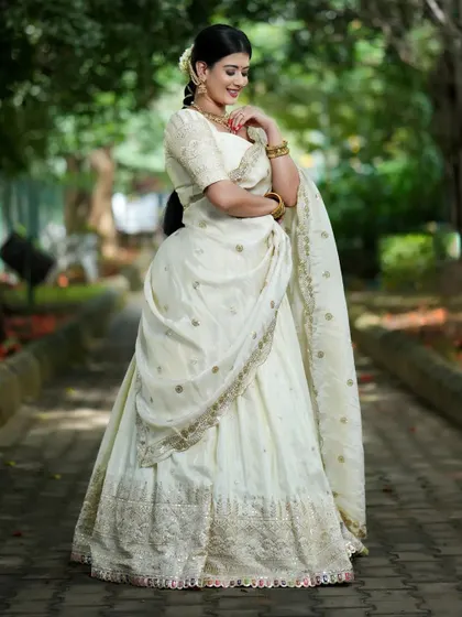 A client looking ethereal in a custom white chikankari lehenga for Navaratri Day 5.