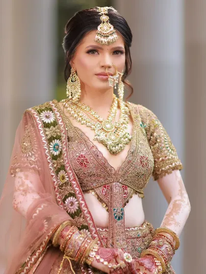 A regal portrait of our beautiful bride. The makeup is flawless, enhancing her features and celebrating her unique skin.