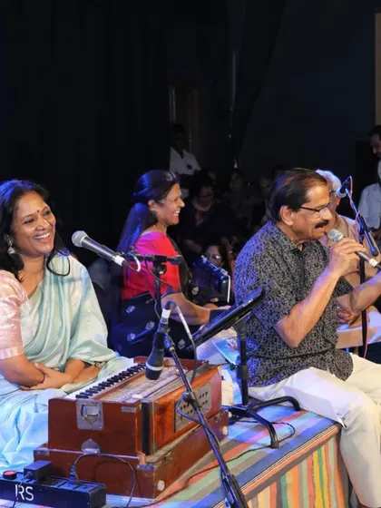 Sharing a lighthearted moment on stage with a fellow artist. Live performances are built on the connection between musicians, and this camaraderie is what brings the music to life.