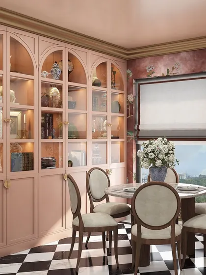 A luxurious dining room concept for a Kolkata project. This design features a classic black-and-white checkered floor, a round marble table, and a stunning pink arched crockery cabinet.