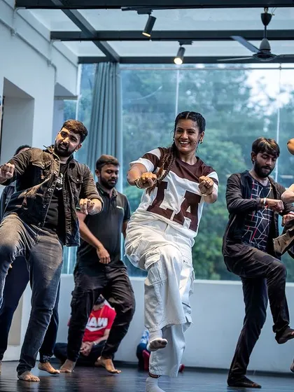 The energy in this shot is contagious. This is a Hip-Hop Bhangra routine, a fusion style I love to teach. It combines the swag of hip-hop with the powerful beats of Bhangra, making for an incredible workout.