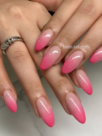 A beautiful, classic pink ombré on long, almond-shaped nails. The gradient is seamless and the color is perfect for any season.