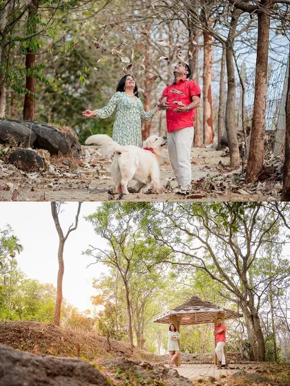 We love incorporating playful and spontaneous moments into our shoots. Here, the couple shares a joyful moment with their dog amidst falling leaves in a wooded area, creating a dynamic and heartwarming family photograph.
