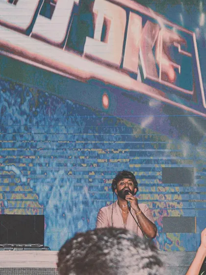 On the mic at Ginza, making sure the ladies night vibe is perfect. It's all about creating an experience, not just playing songs.