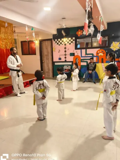 Students lined up and ready for their color belt test at our Palam branch. The test begins with a demonstration of discipline and respect.