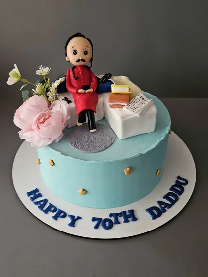 A milestone 70th birthday cake for Daddu. This 2kg chocolate truffle cake features a custom figurine of him relaxing on the sofa.