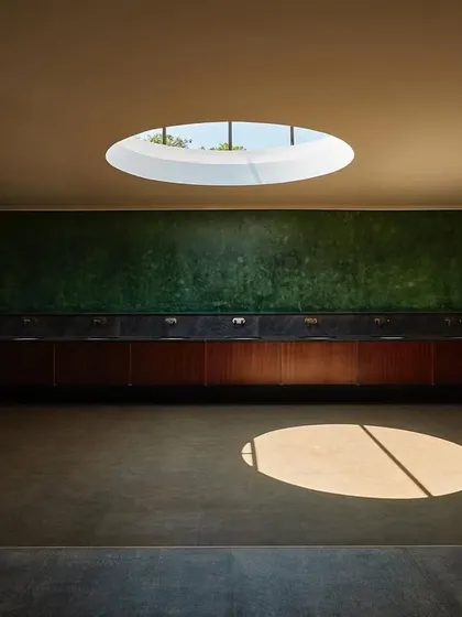 I see every space as an opportunity for art. Here, in a wedding venue, a simple circular skylight transforms a functional area into a canvas for the sun, creating a moving piece of art as light travels across the room throughout the day.