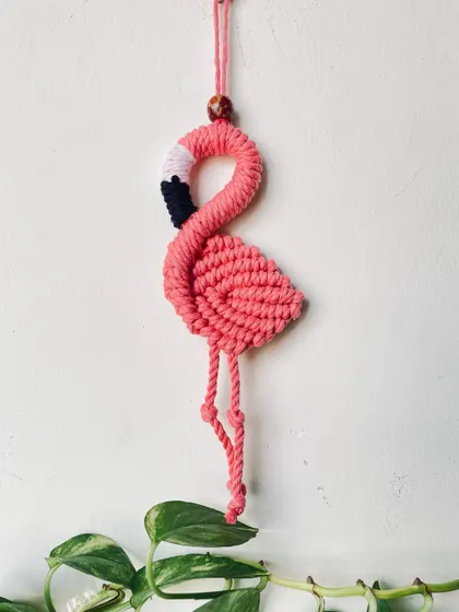 A graceful pink flamingo, perfect for adding a tropical touch to your decor. I love shaping the cord to create its elegant, curved neck.