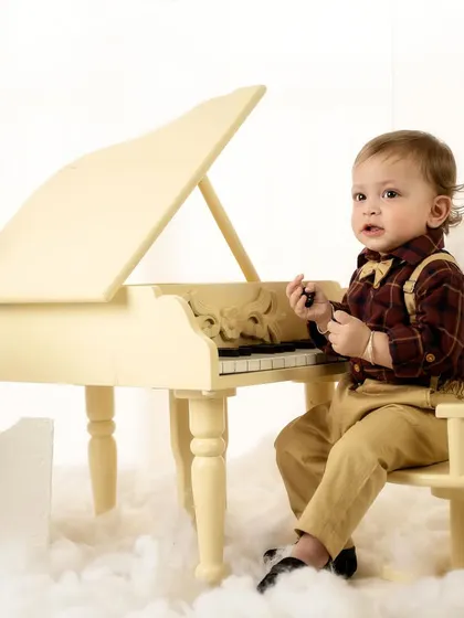 Examining the piano keys. I love capturing these small moments of discovery and curiosity.