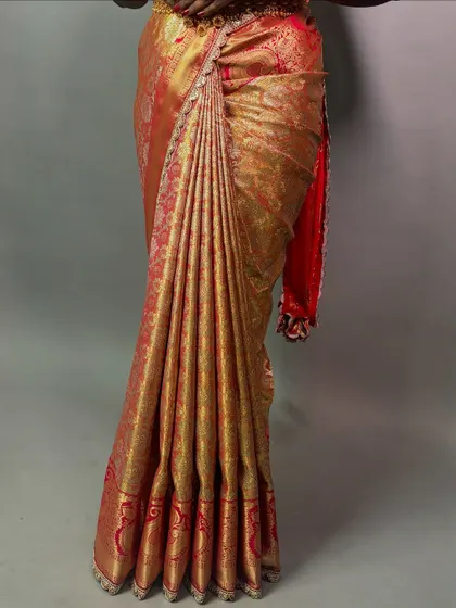 A full view of the saree, showing the beautiful fall of the pleats. This is a testament to the importance of proper draping technique.