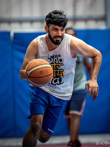 A player driving hard to the basket during one of our fast-paced pickup games at the Ballerdome.