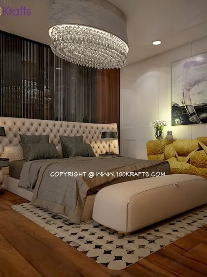 This bedroom design leans into gothic drama with a grand crystal chandelier, a tufted headboard, and rich, dark wood flooring.