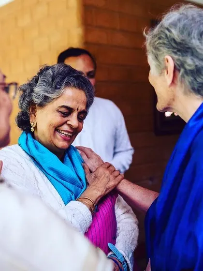 A beautiful, candid moment of shared joy and friendship between members of our sangha. These simple interactions are filled with warmth and mutual support, which are essential on the spiritual path.