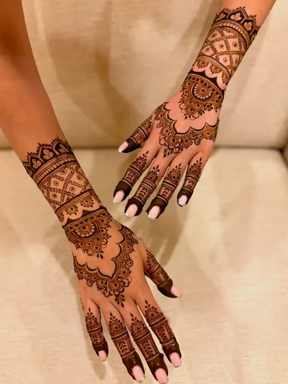 A different angle of the engagement mehendi, showcasing the design's flow from the wrist to the hand.