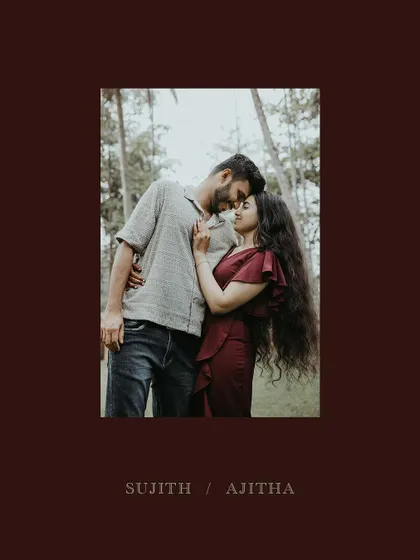 An intimate and loving couple portrait, framed in a deep red border.