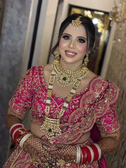 A bright, happy smile from a beautiful bride. Her makeup is flawless and radiant, designed to last through all the smiles and happy tears of the day.