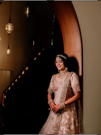 Duplicate of image 396, a smiling portrait of the bride.
