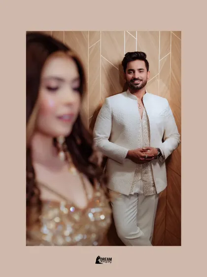 A creative shot of groom Puneet in focus, with his bride Rachita beautifully blurred in the foreground, telling a story of anticipation.