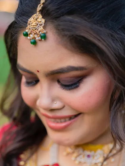 South Indian glam redefined. This close-up shows the subtle smokey eyes and glowing skin that create a timeless and elegant look.
