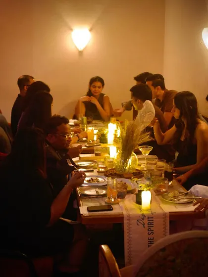 A wider shot of the long table at our menu preview, filled with guests, good food, and great conversation.