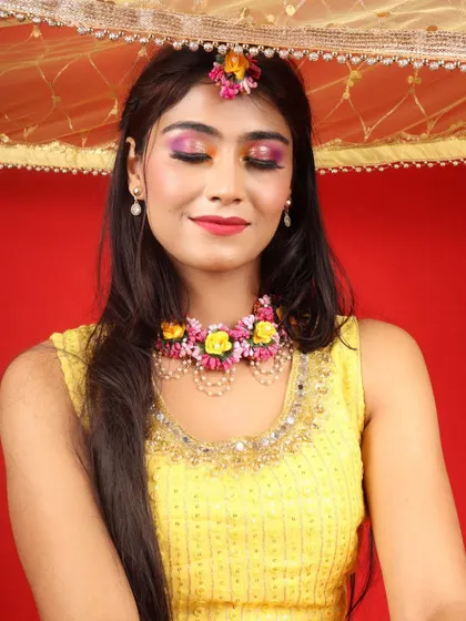 A close-up of the Haldi eye makeup. The blend of bright colors creates a look that is both fun and beautiful for the pre-wedding festivities.