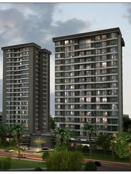 A dusk rendering of the "Palatina" apartment complex in Ghatkopar. The lighting highlights the clean, modern lines of the towers and the lush landscaping at the base.