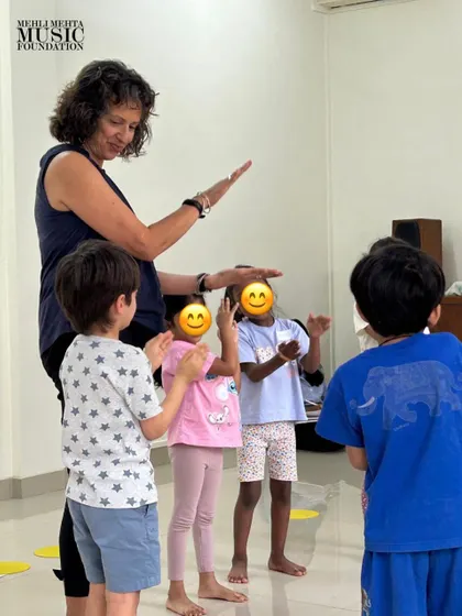 Our guest teacher, Naheed Shimala, guides students through a movement activity. We regularly invite international experts to teach our classes and train our faculty, ensuring the highest quality of music education.