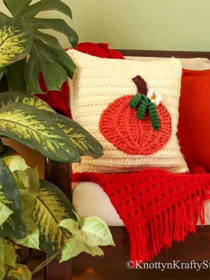 More autumn vibes with the pumpkin cushion paired with a bright red throw. I love layering colours and textures to create a warm and inviting feel.