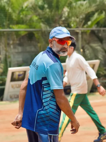 A coach keeps a watchful eye on the field. Their experience allows them to spot areas for improvement with just a single glance.