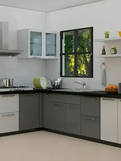 This L-shaped kitchen combines grey and white cabinets with frosted glass doors and a tall unit for a built-in oven. Open shelves provide space for frequently used items.