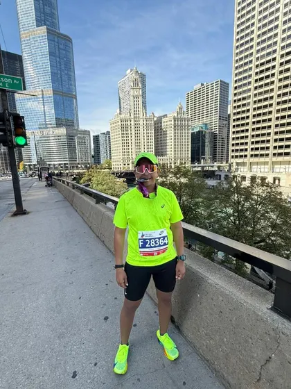 Posing on the course in Chicago. My coaching isn't just about the physical training; it's about building the confidence to stand at any start line in the world and know you are ready.