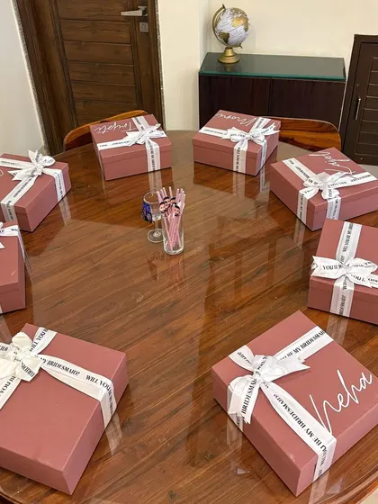 A fleet of personalized bridesmaid proposal boxes ready to go. Each box is customized with the recipient's name in elegant script, making the gift feel personal from the moment they see it.
