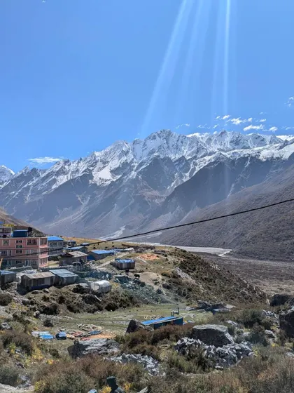 A pathway to heaven. Sun rays break through the clouds over the village of Kyanjin Gompa in the Langtang Valley, with the majestic Mt Gangchempo and Ganja La range in the distance.