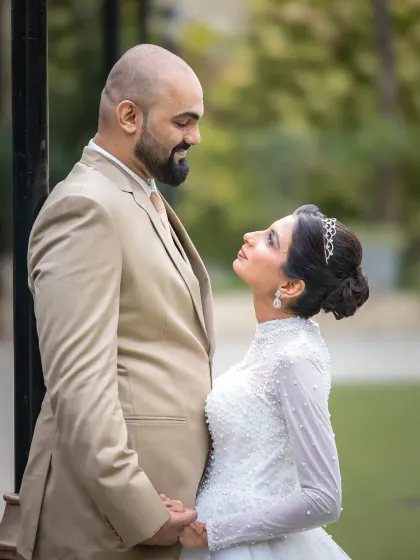 A beautiful close-up capturing the intimate connection between the newlyweds. Their smiles say it all in this timeless wedding portrait.