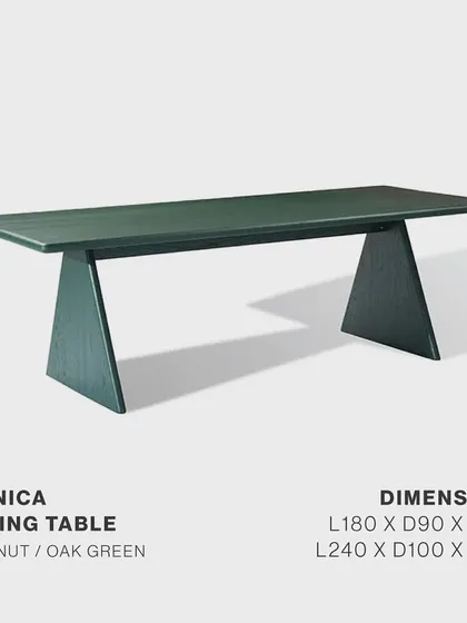 A product shot of the Conica Dining Table, available in dark green or natural walnut. Its sculptural trapezoid base and smooth matte finish make it a statement of refined taste and modern charm.