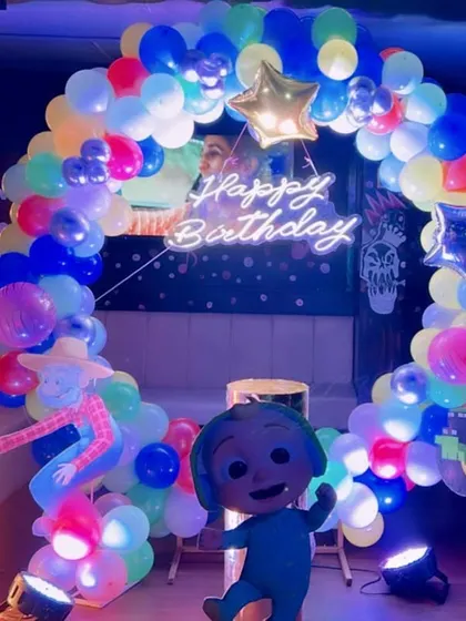 A Cocomelon-themed 3rd birthday party with a neon-lit setup, perfect for a glow-in-the-dark effect.