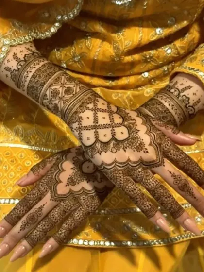 A beautiful example of a full-hand design with delicate check patterns and a scalloped border, creating a very feminine and intricate look for a bride.