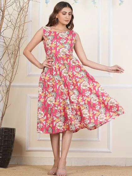 A different pink floral print on my popular tiered dress design. The handmade nature of block prints means each dress has a unique character.