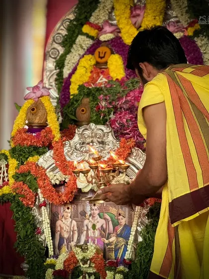 A priest offers aarti to the deities during the Rama Tarak Homa. The circular motion of the lamp symbolizes the eternal nature of the divine.