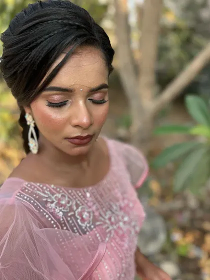A duplicate of image 154, an outdoor shot in the golden hour light. The highlighter on her cheekbones catches the sun beautifully, creating a stunning glow.