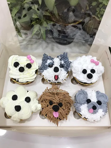 How cute are these puppy-faced cupcakes? I had so much fun piping the different fur textures and expressions for a dog lover's birthday. I can create custom designs like these to match any theme or passion.