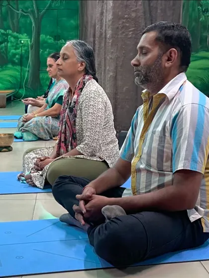 Participants sit in meditation before the sound bath begins. Taking a few moments to center themselves helps them to be more receptive to the healing vibrations of the instruments.