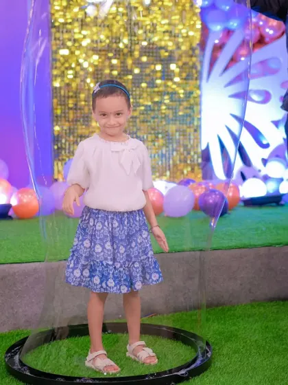 The simple, happy smile of a child inside a bubble says it all. We love creating these moments of wonder for kids at parties, school functions, and family gatherings.