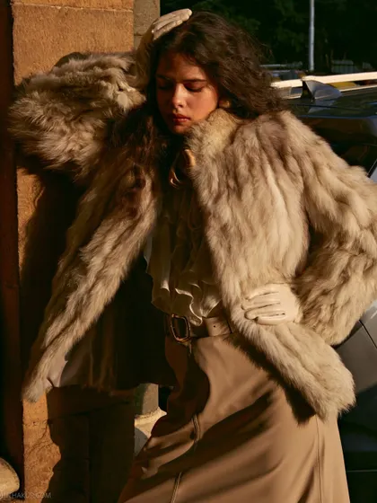 Playing with the harsh afternoon sun to create dramatic shadows. This adds a raw, high-fashion edge to the portrait.