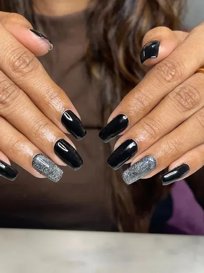 The full two-hand view of the black and silver glitter set. The contrast is dramatic and perfect for a night out.