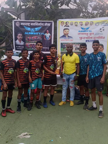 Our U15 champions posing with their coach after winning the Almighty FC tournament.